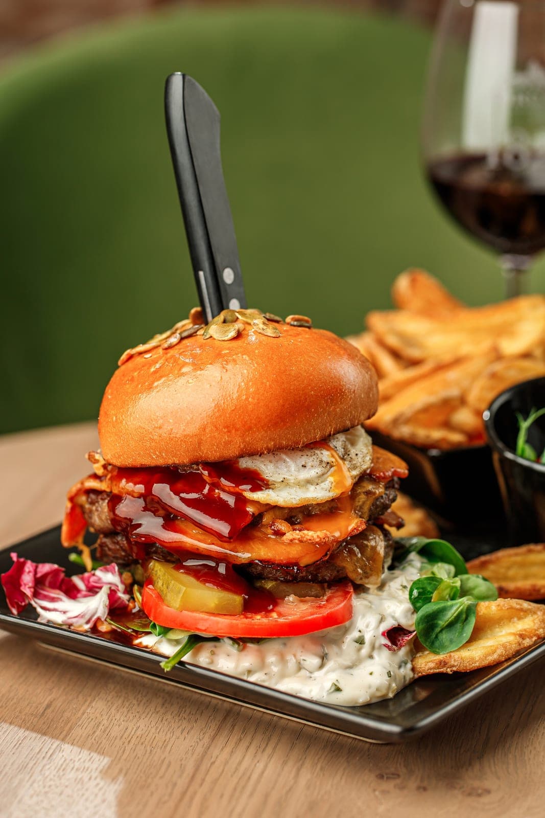 Beef burger with cheddar, bacon and potatoes