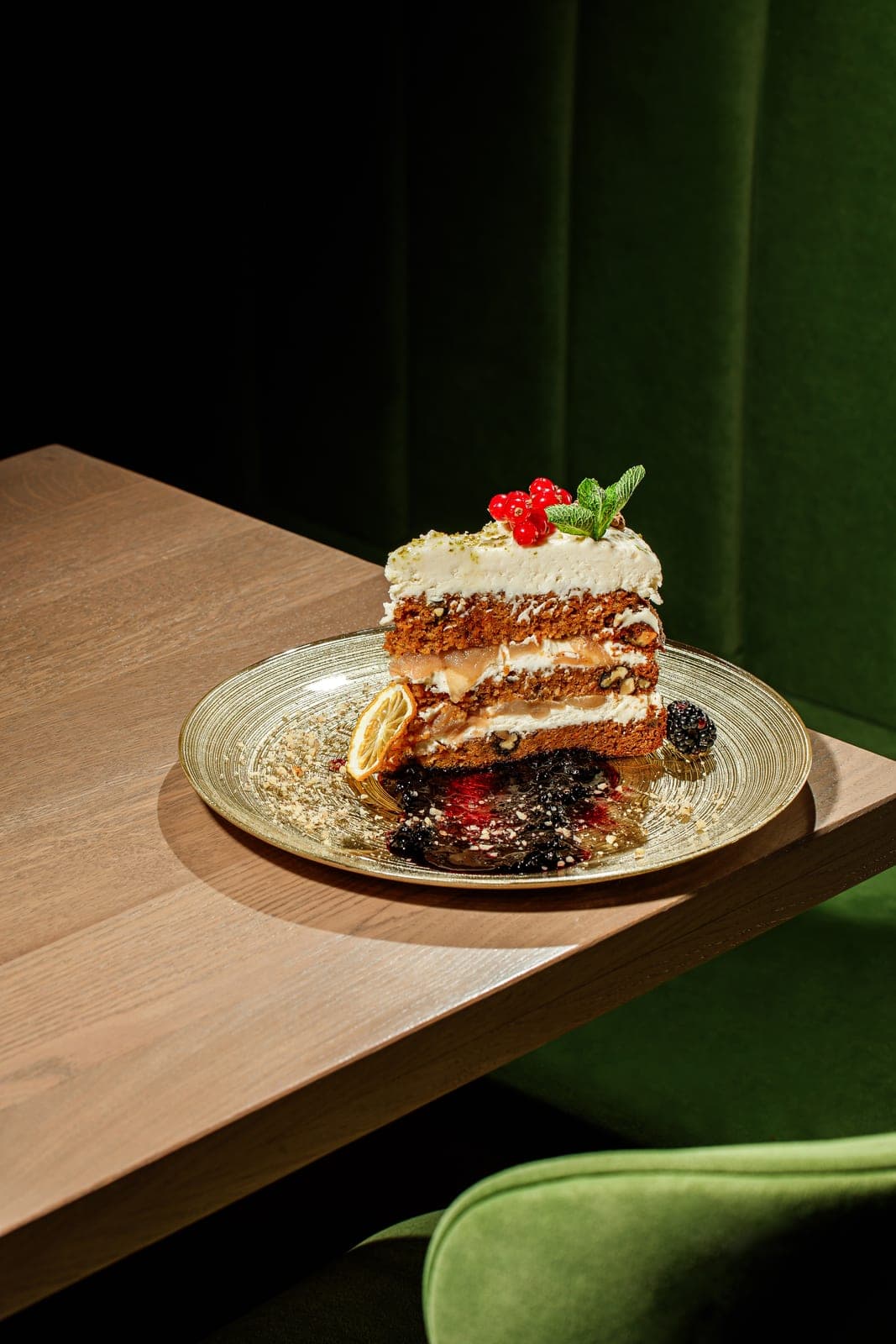 Slice of carrot cake with pears and berries